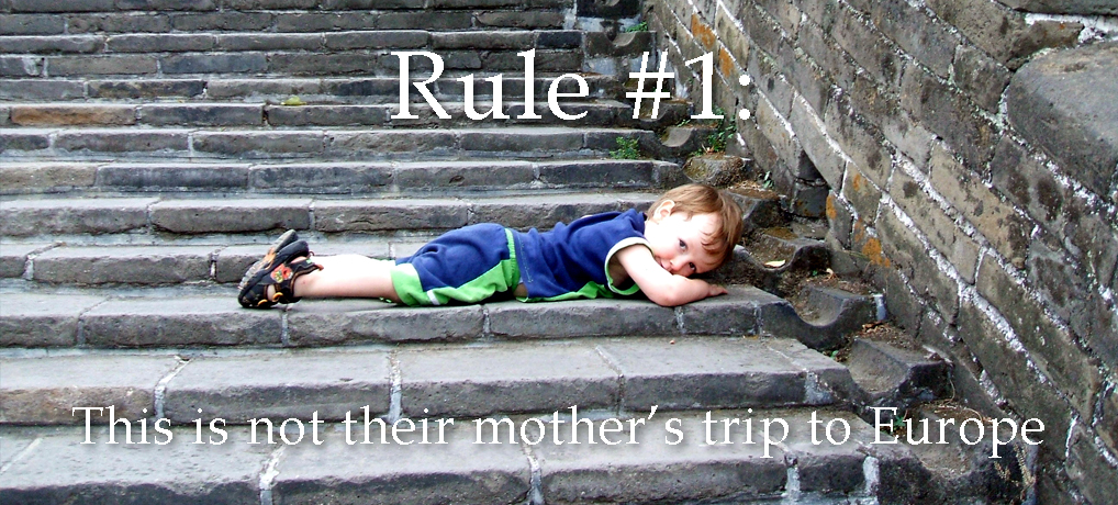 Text reads "Rule #1: This is not their mother's trip to Europe" - tips for international travel with children 