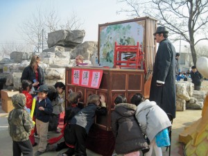 An old-fashioned traveling puppet show!