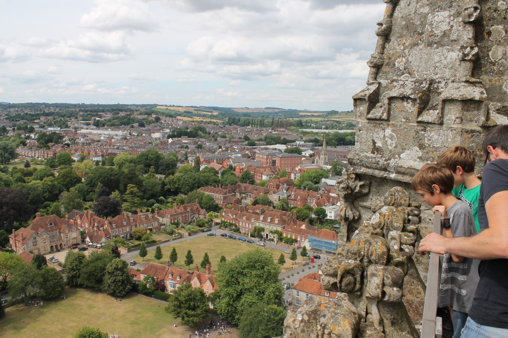The author's husband and children look down from the top of Salisbury Cathedral over the surrounding countryside. 