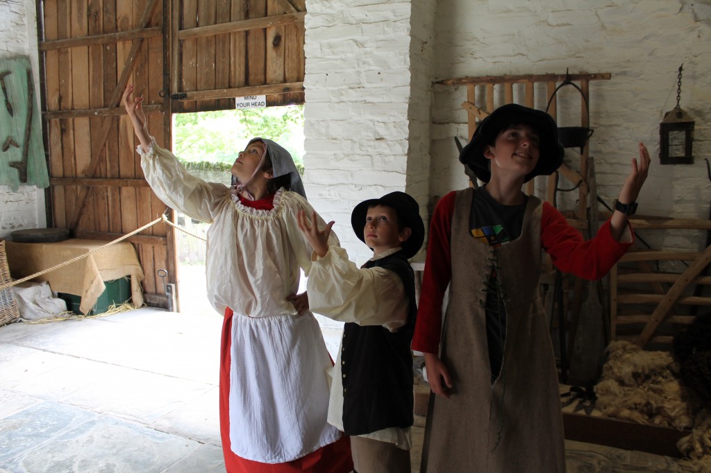 The author's children strike theatrical poses while dressed in (sort of) Elizabethan costume.