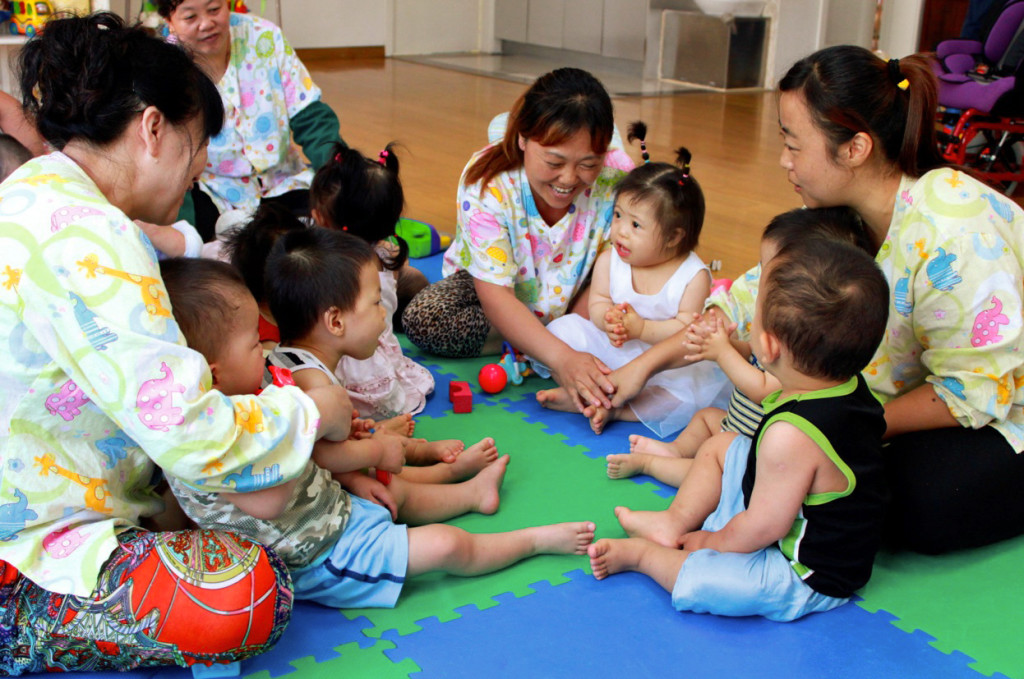 Children and Ayis playing together at China Little Flower.